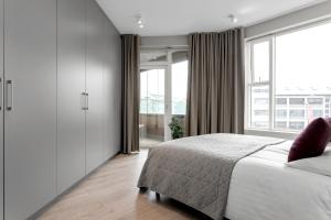 Postel nebo postele na pokoji v ubytování Tower Apartments