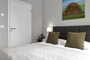 Postel nebo postele na pokoji v ubytování Tower Apartments