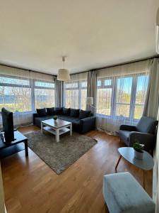 a living room with a couch and a table at Peperino in Gdańsk