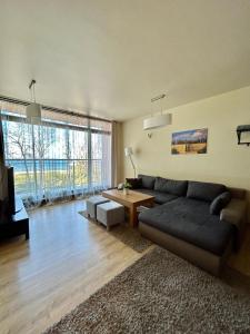 a living room with a couch and a table at Peperino in Gdańsk