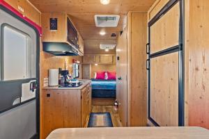 a kitchen and a bedroom in a rv at JT Village Campground - Sun Ray in Joshua Tree