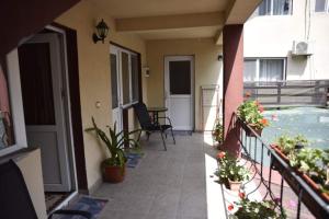 a balcony of a house with a swimming pool at Pensiunea sellina in Sulina