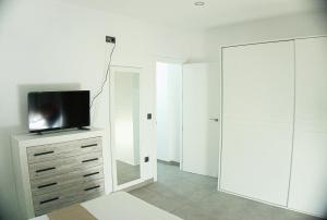 TV a/nebo společenská místnost v ubytování Apartamento Vistas de Doñana