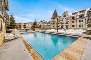 a swimming pool in the middle of a building at Spacious Luxury Unit at Lionshead Village in Vail in Vail