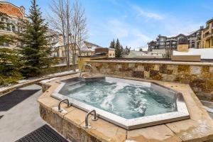 a hot tub with two faucets on top of a building at Spacious Luxury Unit at Lionshead Village in Vail in Vail