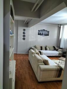 a living room with a couch and a table at Şişli Özcan 1 in Istanbul