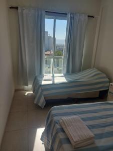 Ένα ή περισσότερα κρεβάτια σε δωμάτιο στο DEPARTAMENTO CENTRICO CATAMARCA