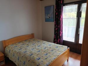 Posteľ alebo postele v izbe v ubytovaní Maison bord de mer, dans impasse au calme d'une résidence.