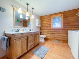 a bathroom with a sink and a toilet at Elkhorn 3 Bedroom 2 Bathroom Log Cabin Sleeps 8 - Lincoln Log Cabin in Elkhorn +27 photos