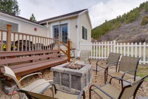 a patio with chairs and a fire pit and a house at Empire Vacation Rental with Fire Pit and Gas Grill! in Empire