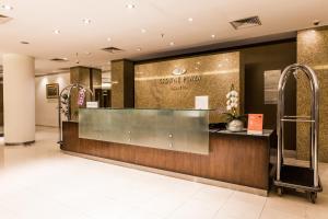 a lobby of a luxury hotel with a reception desk at Crowne Plaza Asunción, an IHG Hotel in Asuncion