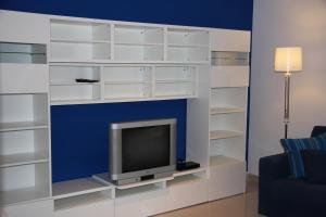 TV a/nebo společenská místnost v ubytování Appartamento Giglio