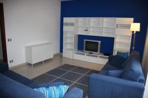 TV a/nebo společenská místnost v ubytování Appartamento Giglio