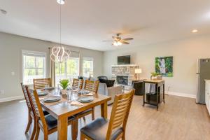 a dining room and living room with a table and chairs at Charming Helen Vacation Rental 2 Mi to Village! in Helen