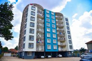 a building with balconies on the side of it at Stylish 3-bedroom condo with a Power-backup, Swimming pool and Gym in Kampala