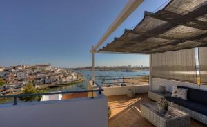 a balcony with a view of a harbor at Vila Vida in Ferragudo