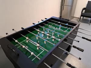 a foosball table with a group of baseball players on it at Veselá lama U nás doma in Baška