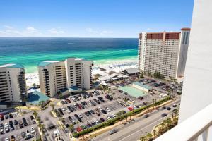 a view of the beach from the balcony of a building at Laketown Wharf #2011 by Nautical Properties in Panama City Beach