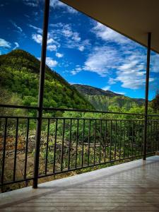 a view of the mountains from a balcony at White House In Borjomi in Borjomi