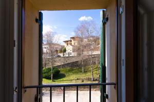 a window with a view of a castle at A CASA DI LUPO in Cison di Valmarino