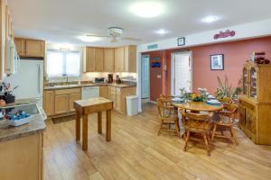 a kitchen and dining room with a table and chairs at Charming Old Saybrook Home Half-Mi to Sand and Sea! in Old Saybrook