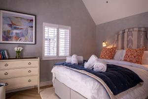 a bedroom with a large bed and a dresser at The Nook in Burley