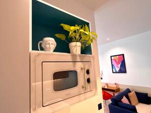 Televízia a/alebo spoločenská miestnosť v ubytovaní Roma Reva: design et home cinema