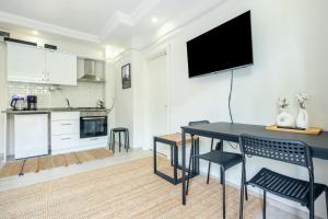 a living room with a black table and chairs at Charming Flat with Balcony in Sapanca Sakarya in Sakarya