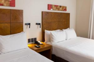 Кровать или кровати в номере Crowne Plaza Asunción by IHG