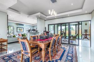a dining room with a table and chairs at Pearl House in Centurion