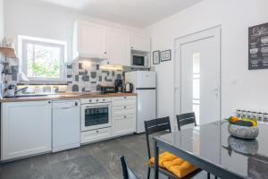 Η κουζίνα ή μικρή κουζίνα στο Apartment Giardino, Ika-Opatija +5 φωτογραφίες