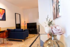 Televízia a/alebo spoločenská miestnosť v ubytovaní Roma Reva: design et home cinema