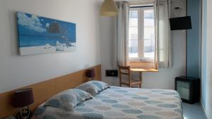 Postel nebo postele na pokoji v ubytování WEAA Hotel