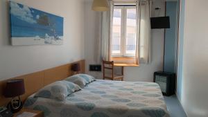 Postel nebo postele na pokoji v ubytování WEAA Hotel