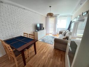 TV a/nebo společenská místnost v ubytování Apartament Gruba Ryba