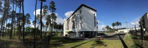 a building that is sitting on the side of a road at B&B HOTEL Mont-de-Marsan in Saint-Avit