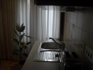 a kitchen counter with a sink and a window at Central Sibenik Apartments in Šibenik +28 photos