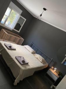 Postel nebo postele na pokoji v ubytování MK Residences