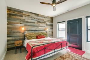 a bedroom with a wooden accent wall and a bed at Near Skiing and Hiking Mtn-View Home in Parowan! in Parowan