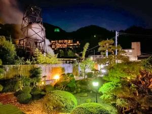 a view of a garden at night at WASEIDOU ZEN - Vacation STAY 17184v in Kobe