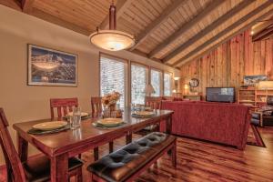a dining room with a table and chairs and a couch at Killdeer - Unit 6 in Sunriver