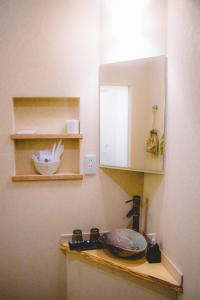 a kitchen counter with a sink and a cabinet at WASEIDOU ZEN - Vacation STAY 19515v in Kobe