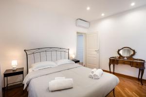 Кровать или кровати в номере Casa mia a Nervi