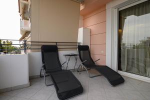 A balcony or terrace at Marine Luxury Apartment Kalamata