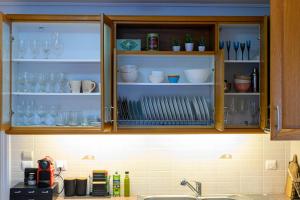 A kitchen or kitchenette at Marine Luxury Apartment Kalamata