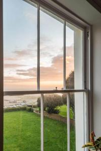 a window with a view of the ocean at Jane's View - Luxury apartment with breathtaking views in Kent