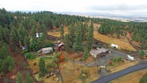 an aerial view of a house in the forest at Whitebird Summit BNB in Whipsaw Saddle