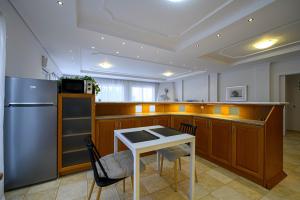 A kitchen or kitchenette at Marine Luxury Apartment Kalamata