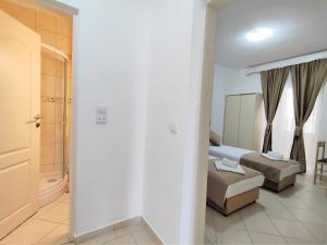 Postel nebo postele na pokoji v ubytování Villa Hera