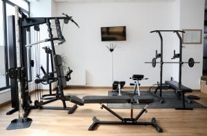 a gym with several tread machines in a room at Vitan Central Oasis - NEW Building - FREE Secured Private PARKING - Self Check-in - in Bucharest